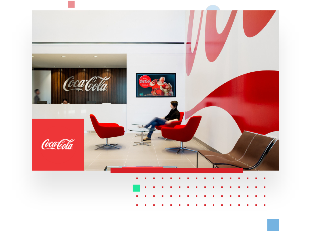 picture of a Coca Cola office, portraying a visitor in the reception area in order to illustrate the Coca Cola testimonial