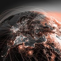 Highly detailed planet Earth at night with embossed continents, illuminated by light of cities. Earth is surrounded by a luminous network, representing the major air routes based on real data